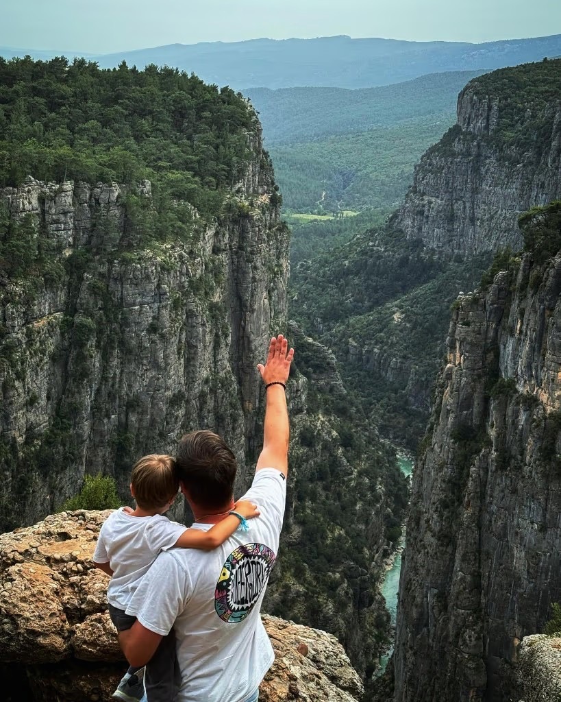 Alex and child overlooking a canyon