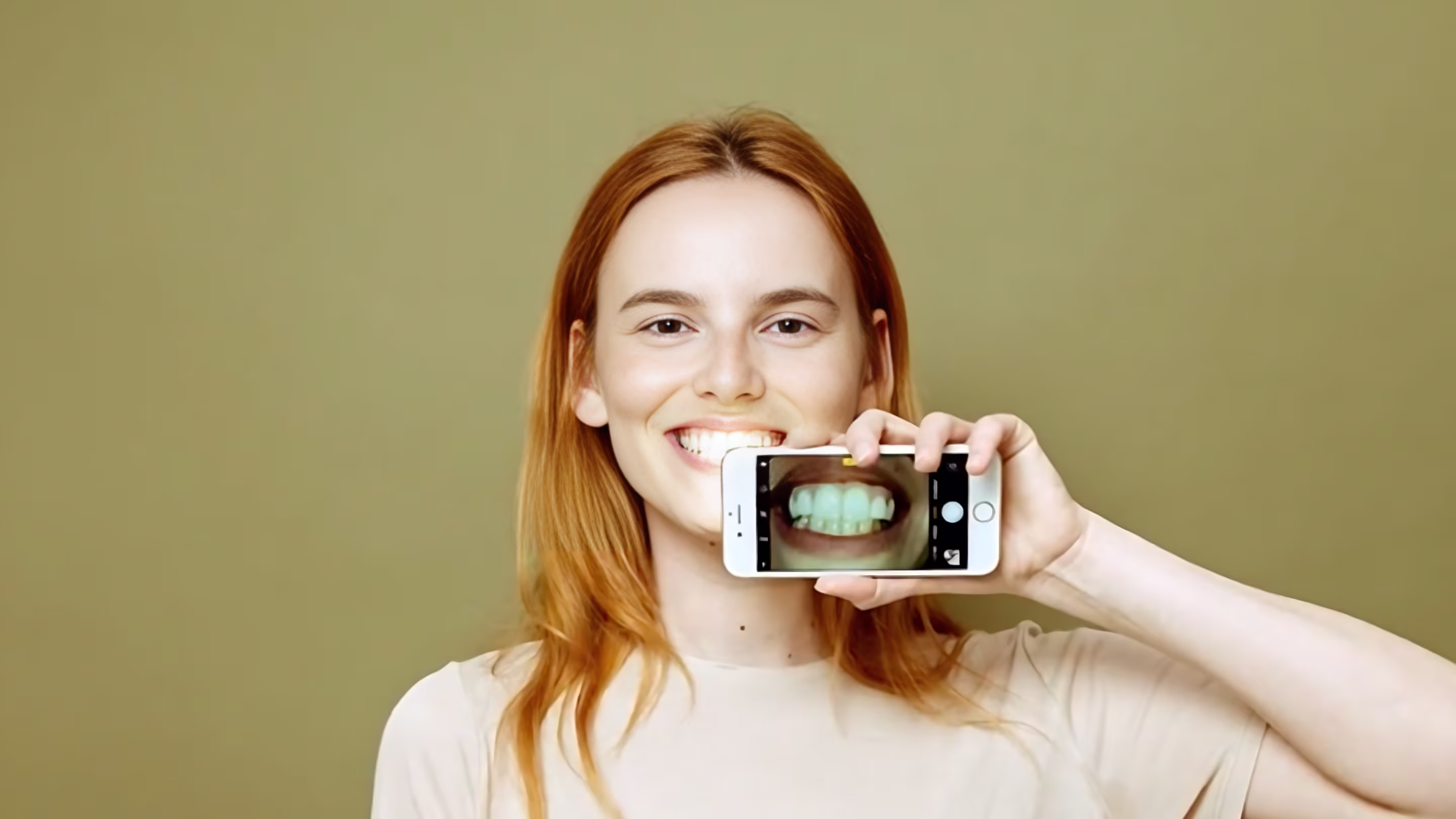 Patient using Adent on phone to view dental care at home